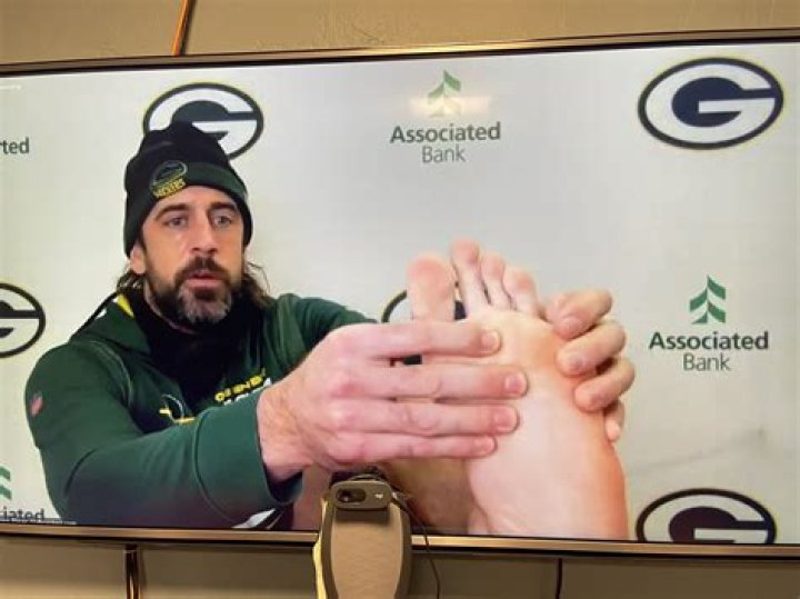 Aaron Rodgers Is Dealing With ‘Covid Toe’ & Fans Say It’s From ‘Sticking Your Foot In Your Mouth’