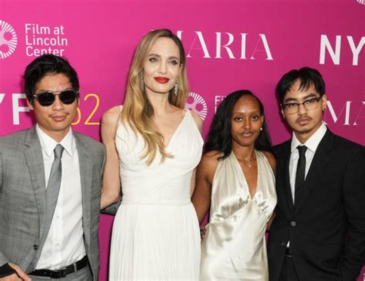 Angelina Jolie Grabs An NYC Hot Dog With Sons Pax, 17, & Knox, 12, After Brad Pitt Gets Joint Custody