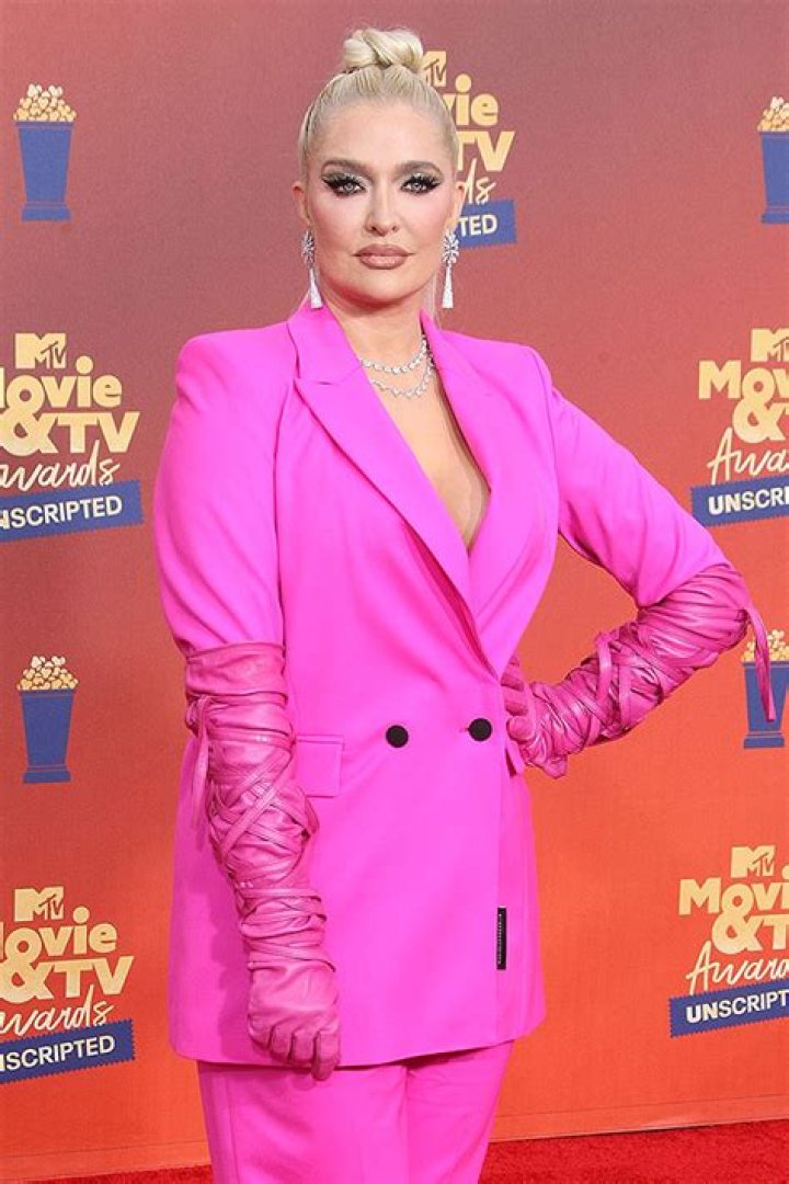 Erika Jayne Covers Herself With Just Her Long Blonde Hair As She Poses For Sexy Photo