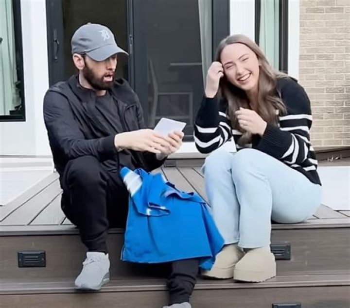 Eminem’s Daughter Hailie Rocks High-Slit Dress & Boots On Winter Vacation — Photo