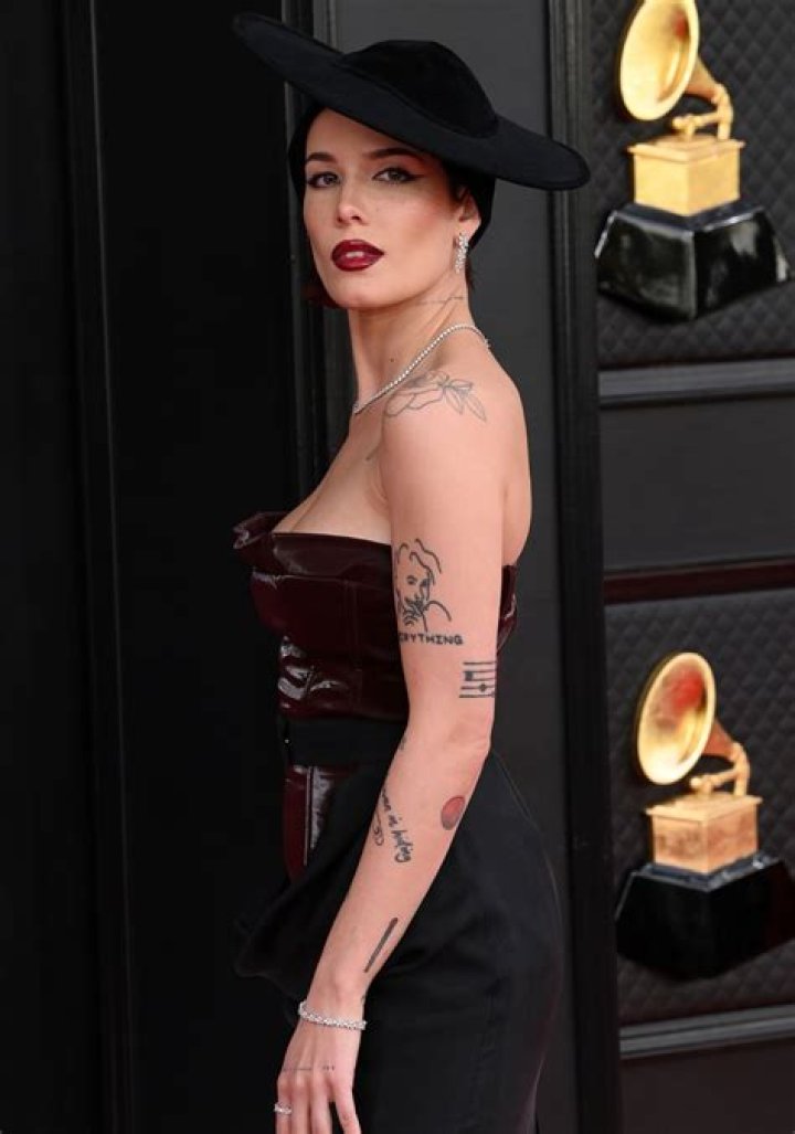 Halsey Slays In Burgundy Leather Bustier & Black Skirt At GRAMMYs After Surgery: Photos
