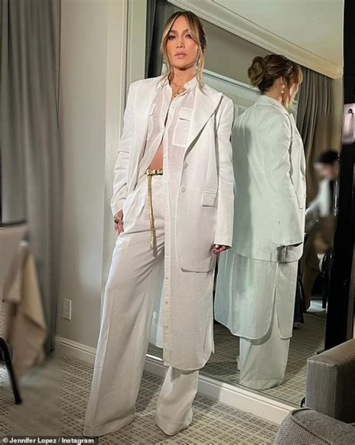 Jennifer Lopez Is Glowing In White Pantsuit In NYC After ‘Halftime’ Premiere: Photos