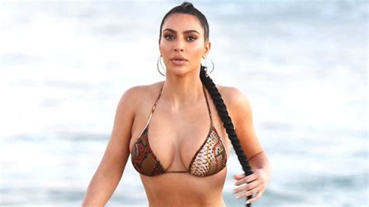 Kim Kardashian Chows Down On A Taco While Wearing Neon Yellow Bikini In New Photo