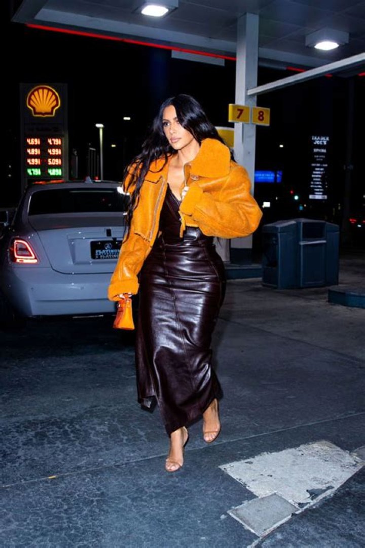 Kim Kardashian Wears Orange Yeezy Jacket Exiting Rolls Royce: Pics – Hollywood Life