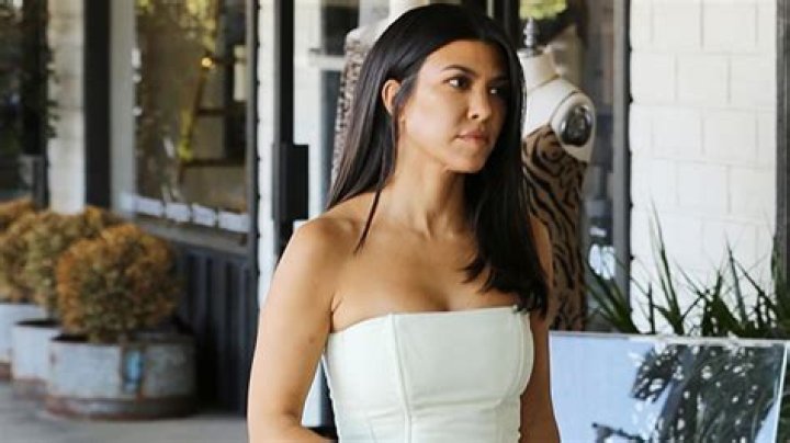 Kourtney Kardashian Wows In White Strapless Corset & White Pants For New Elongating Look