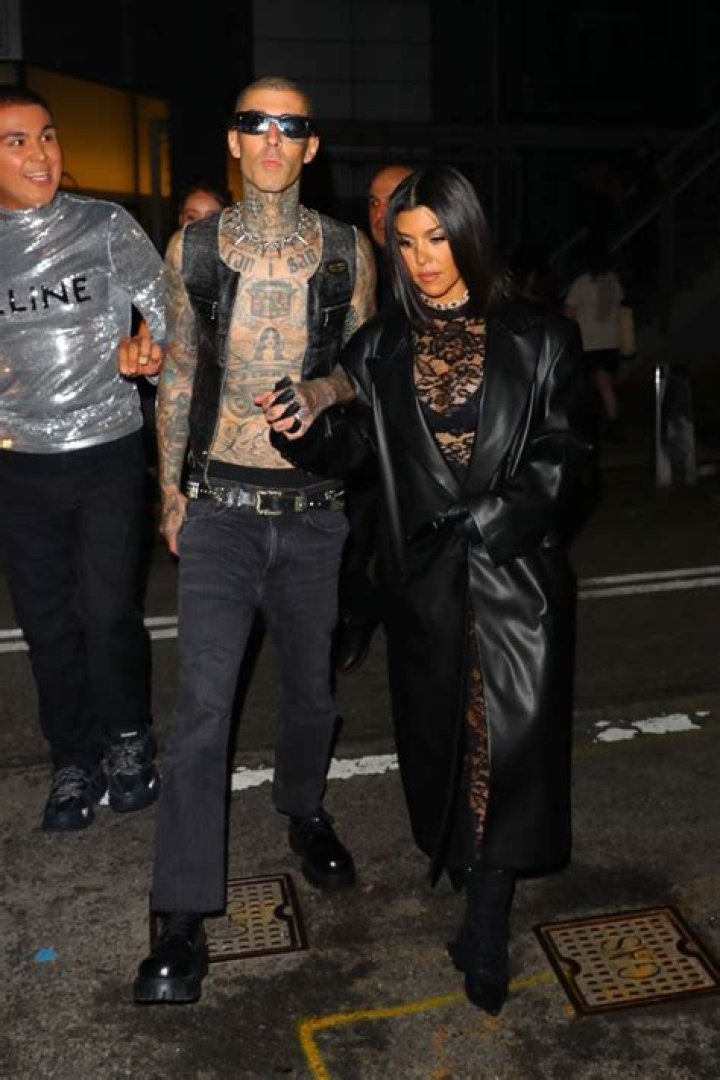 Kourtney Kardashian Rocks Lacy See-Through Catsuit With Travis Barker At NYFW Boohoo Show