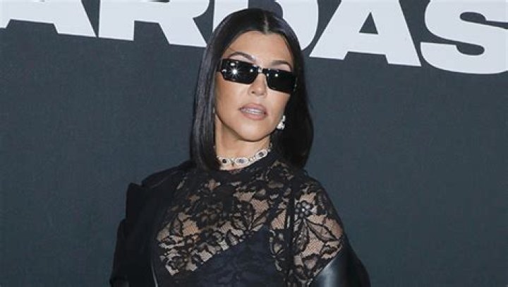 Kourtney Kardashian Rocks Fishnet Dress & Cradles Her Baby Bump in New Photos