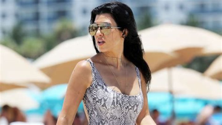 Kourtney Kardashian Sizzles In Snakeskin Bustier Top As She Calls Herself ‘Red Rum’