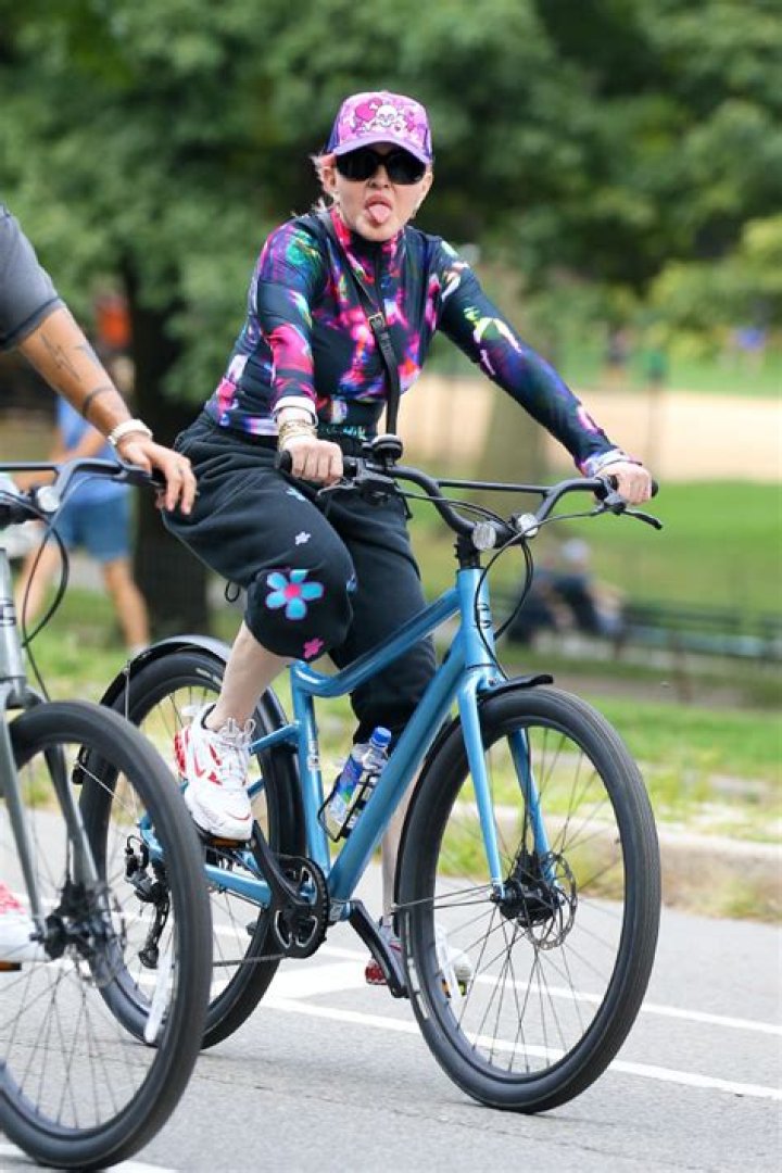 Madonna Sticks Out Tongue During Bike Ride In NYC: Photos – Hollywood Life