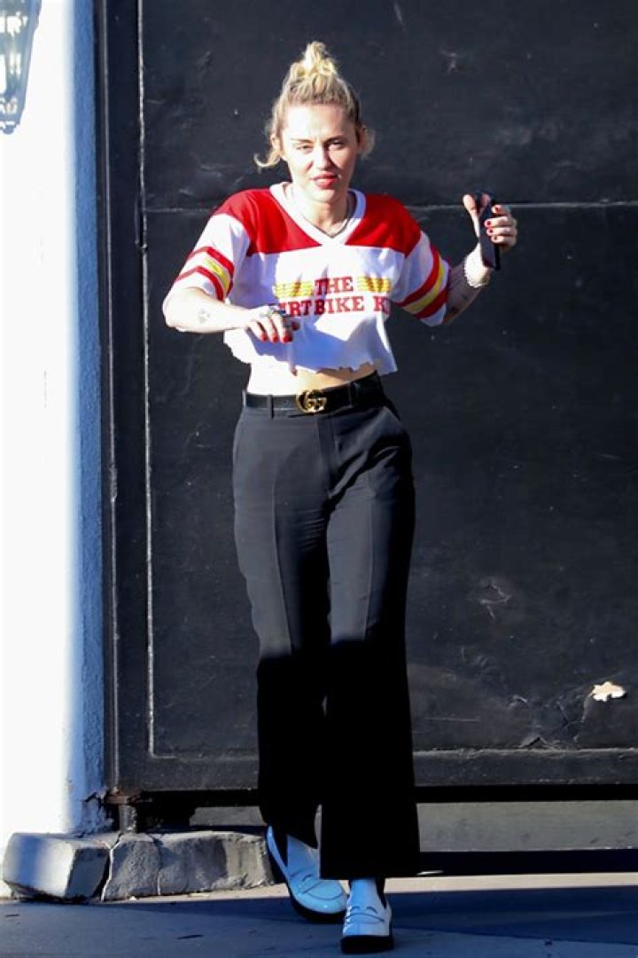 Miley Cyrus Heads To The Hair Salon Wearing Crop Top & Gucci-Belted Pants — Photos