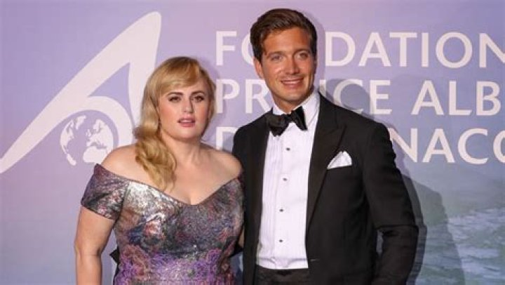 Rebel Wilson Cozies Up To Shirtless Boyfriend Jacob Busch After They Make Their Red Carpet Debut