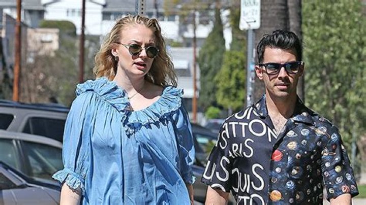 Sophie Turner’s Blue Dress Clings To Her Stomach In New Pics Amid Pregnancy Reports
