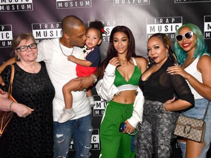 Tiny Cradles Daughter Zonnique’s Baby Bump In Sexy Black Jumpsuit At T.I.’s 40th Birthday Bash — Pic